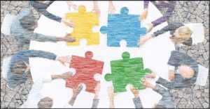 autism-resources-business-people-putting-together-jigsaw-puzzle