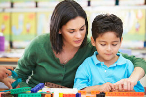 autism-resources-child-counting-blocks-during-school