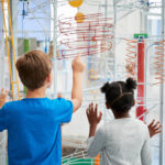 children pointing to display at children's museum
